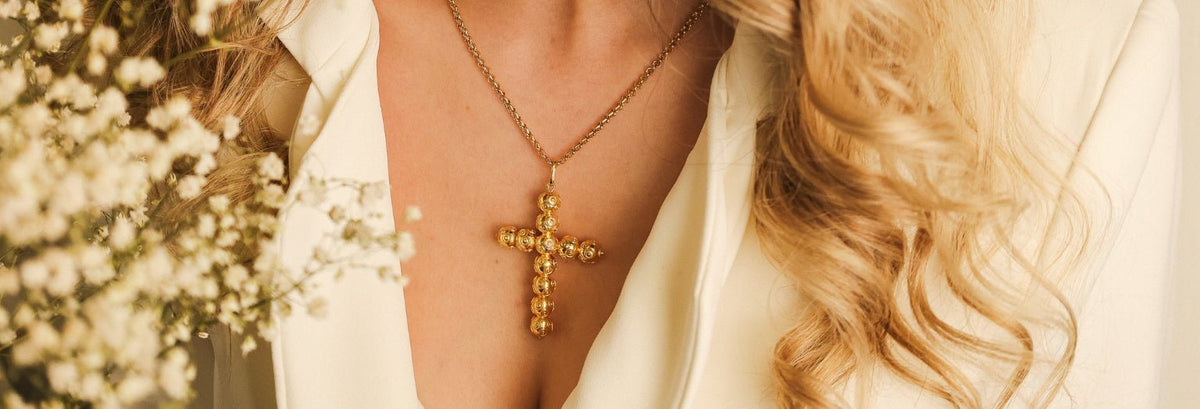 Crucifixos em ouro e prata: símbolos de fé que atravessam o tempo - Loja do Ouro
