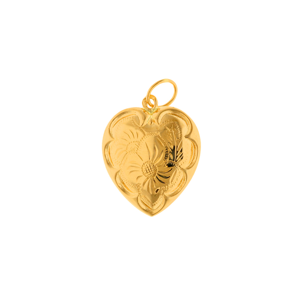 A Medalha Coração em Ouro com Motivos Florais é uma verdadeira obra de arte. Os seus delicados detalhes florais acrescentam um toque de beleza e romantismo à peça.  Esta medalha é perfeita para ser usada como pendente num fio, permitindo criar um look clássico e cheio de elegância. 