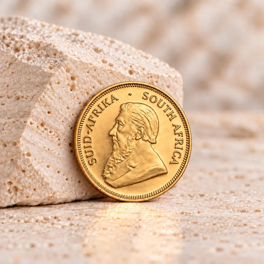 Moeda sul-africana Krugerrand de um quarto de onça, com cunhagem tradicional em ouro.